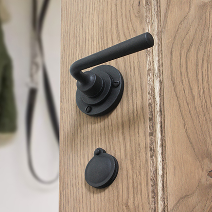 black lever handle on oak door
